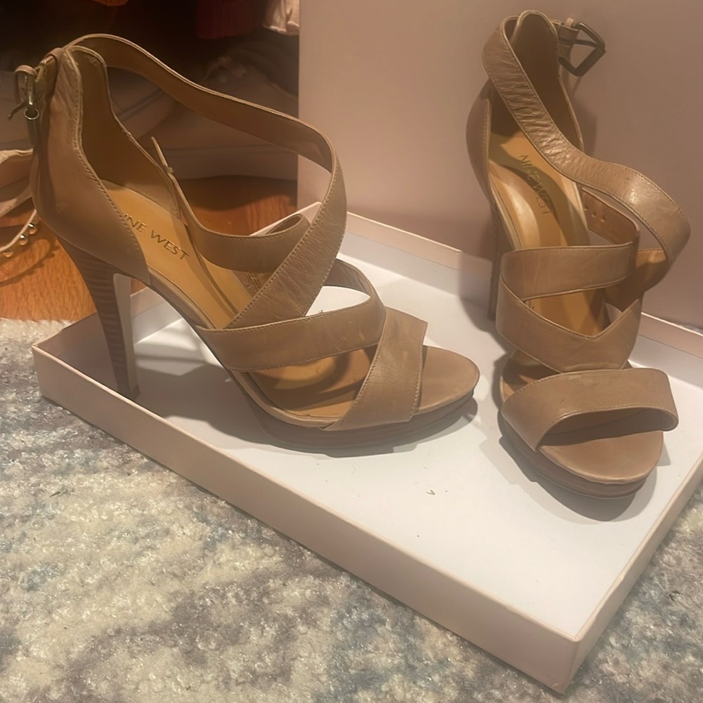 Gently used None West woman’s strappy heels buckle closure